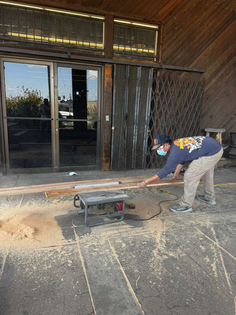 Cutting wood for the sanctuary build
